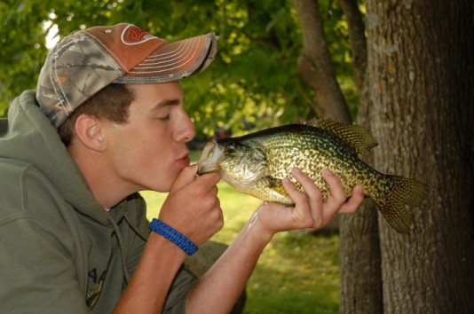 Ben kissing a Crappie